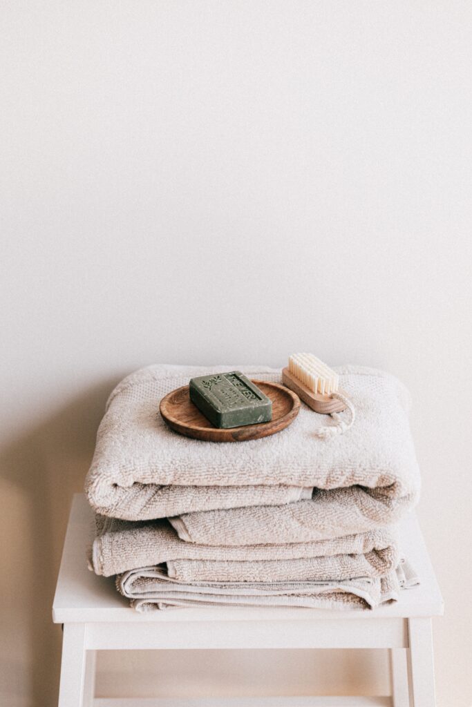 Natural toiletries and towels, representing PFAS-free personal care product choices