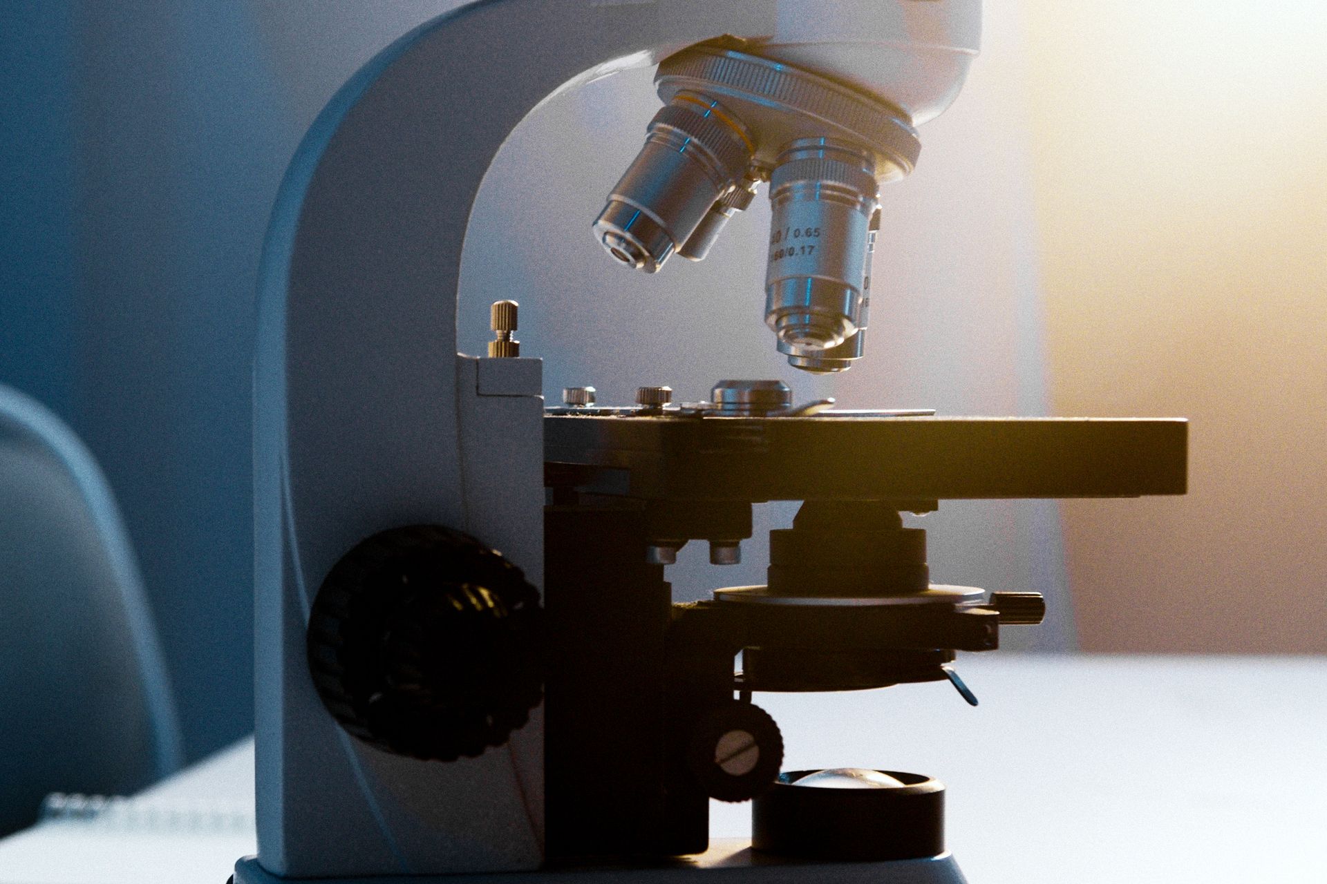 A light microscope on a laboratory table.