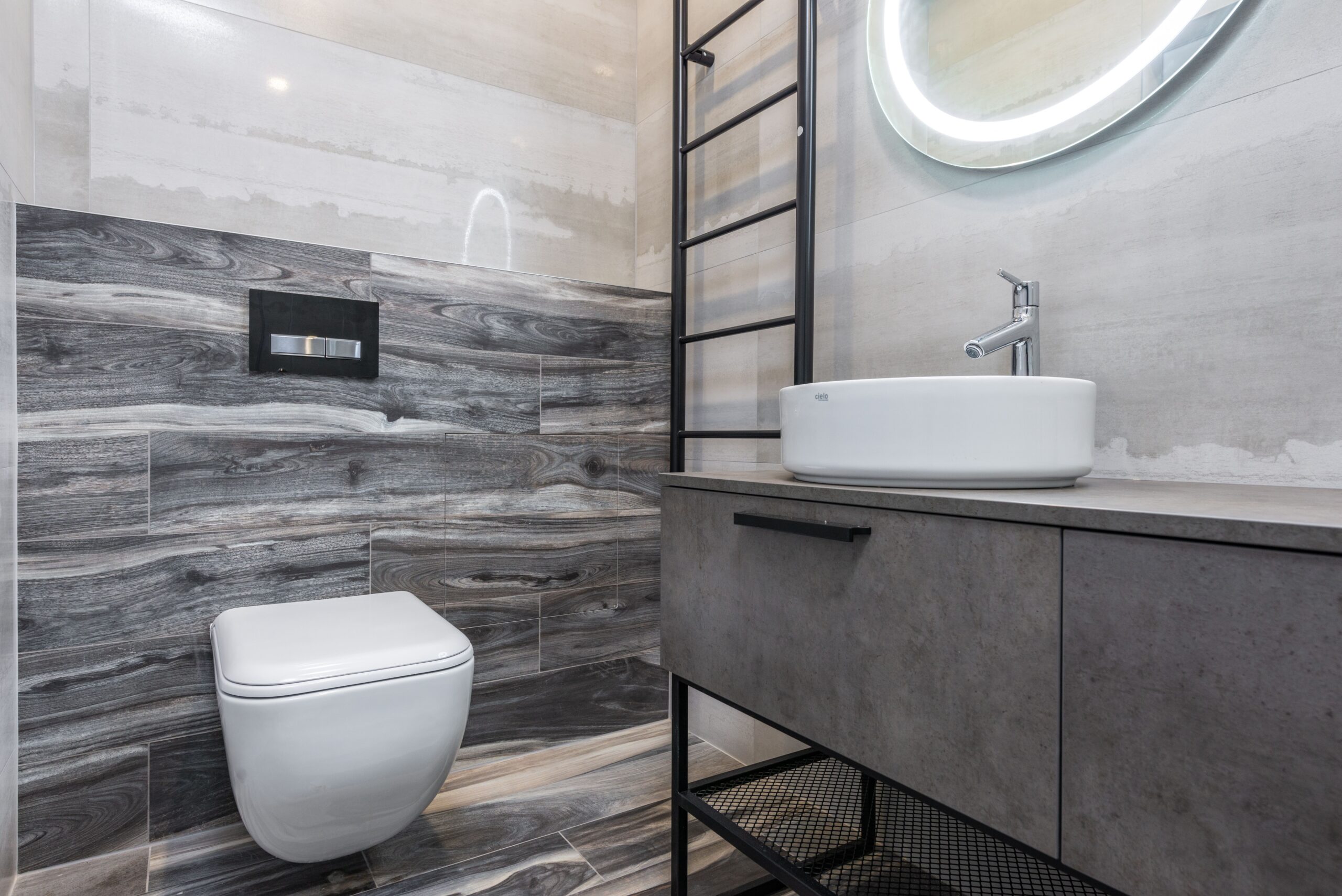A bright modern bathroom with a wall-mounted toilet
