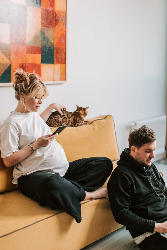 Pregnant woman resting calmly at home, prioritizing safe pregnancy self-care over douching