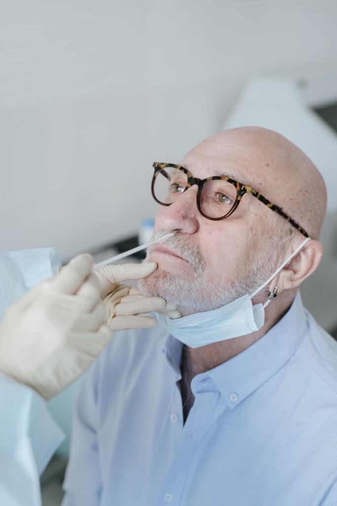 Person receiving a nasal swab COVID-19 test