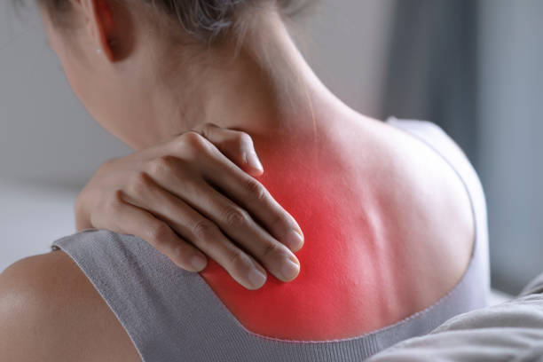 woman fibromyalgia pain fatigue tired holding neck